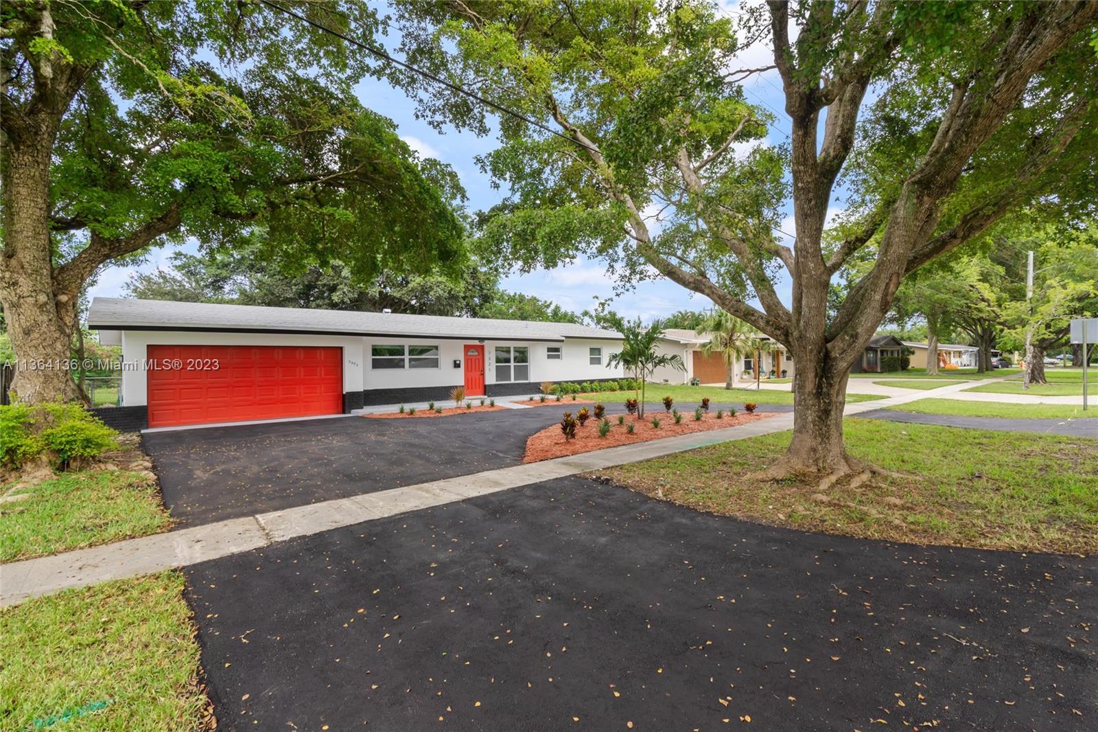 7321 Northwest 11th Place Plantation, FL 33313 - Photo 2 of 23 a view of street with trees