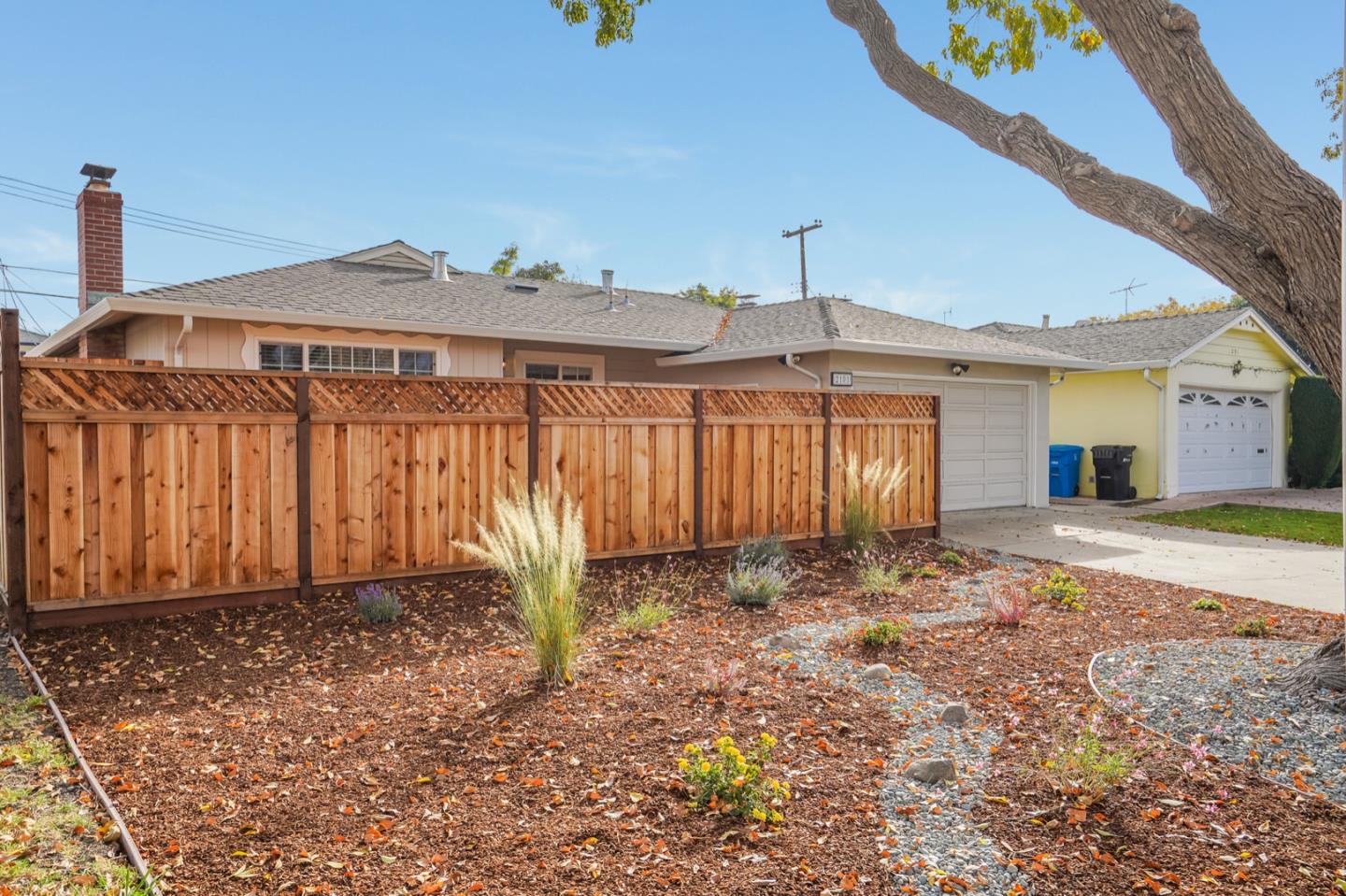 2101 Briarwood Drive Santa Clara, CA 95051 - Photo 2 of 41 a front view of a house with a yard