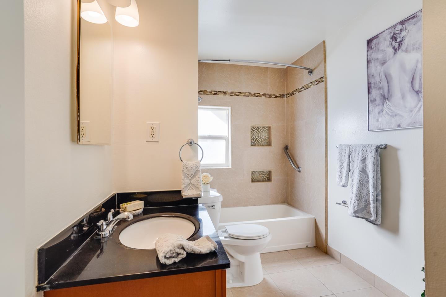 2101 Briarwood Drive Santa Clara, CA 95051 - Photo 14 of 41 a bathroom with a toilet a sink and bathtub