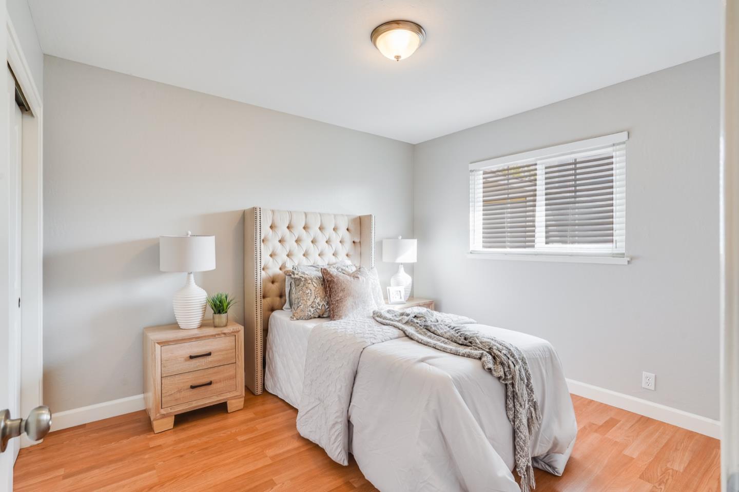 2101 Briarwood Drive Santa Clara, CA 95051 - Photo 18 of 41 a bedroom with a bed and a window