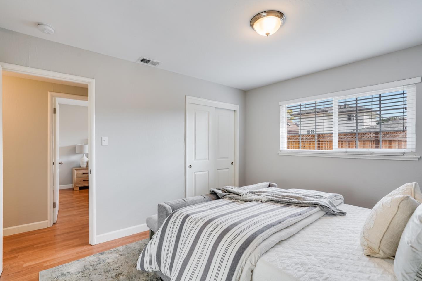 2101 Briarwood Drive Santa Clara, CA 95051 - Photo 23 of 41 a bedroom with a bed and a window