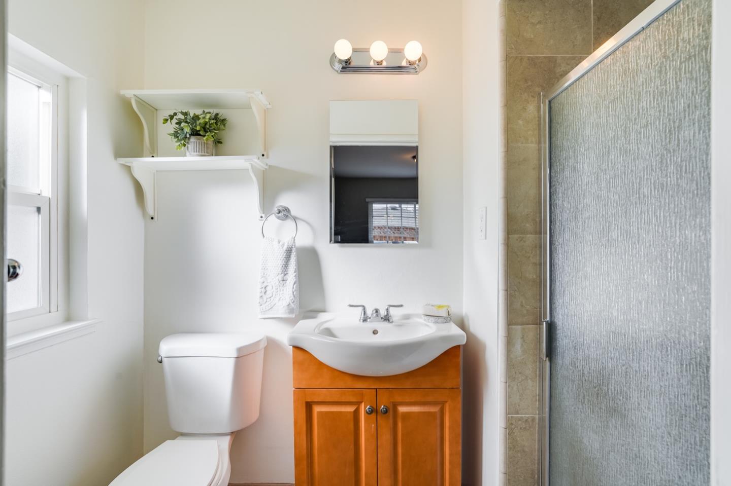 2101 Briarwood Drive Santa Clara, CA 95051 - Photo 24 of 41 a bathroom with a sink a mirror and a toilet
