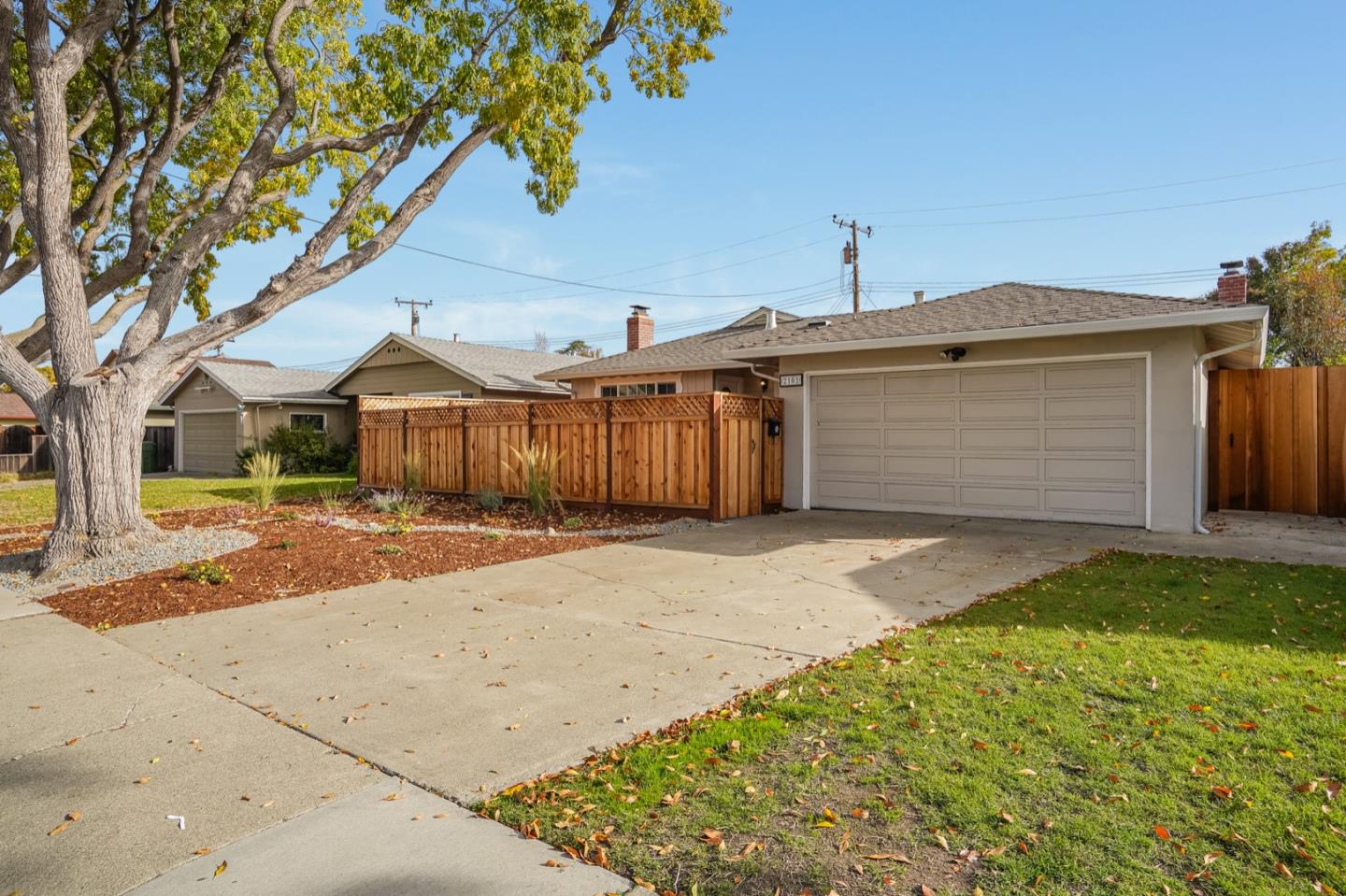 2101 Briarwood Drive Santa Clara, CA 95051 - Photo 34 of 41 a front view of a house with a yard and garage
