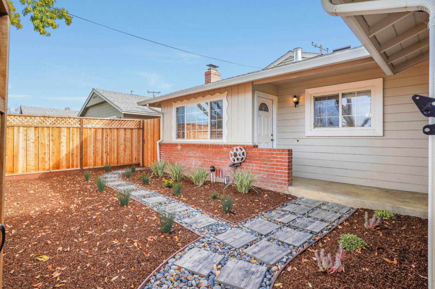 2101 Briarwood Drive Santa Clara, CA 95051 - Photo 36 of 41 a front view of a house with a yard