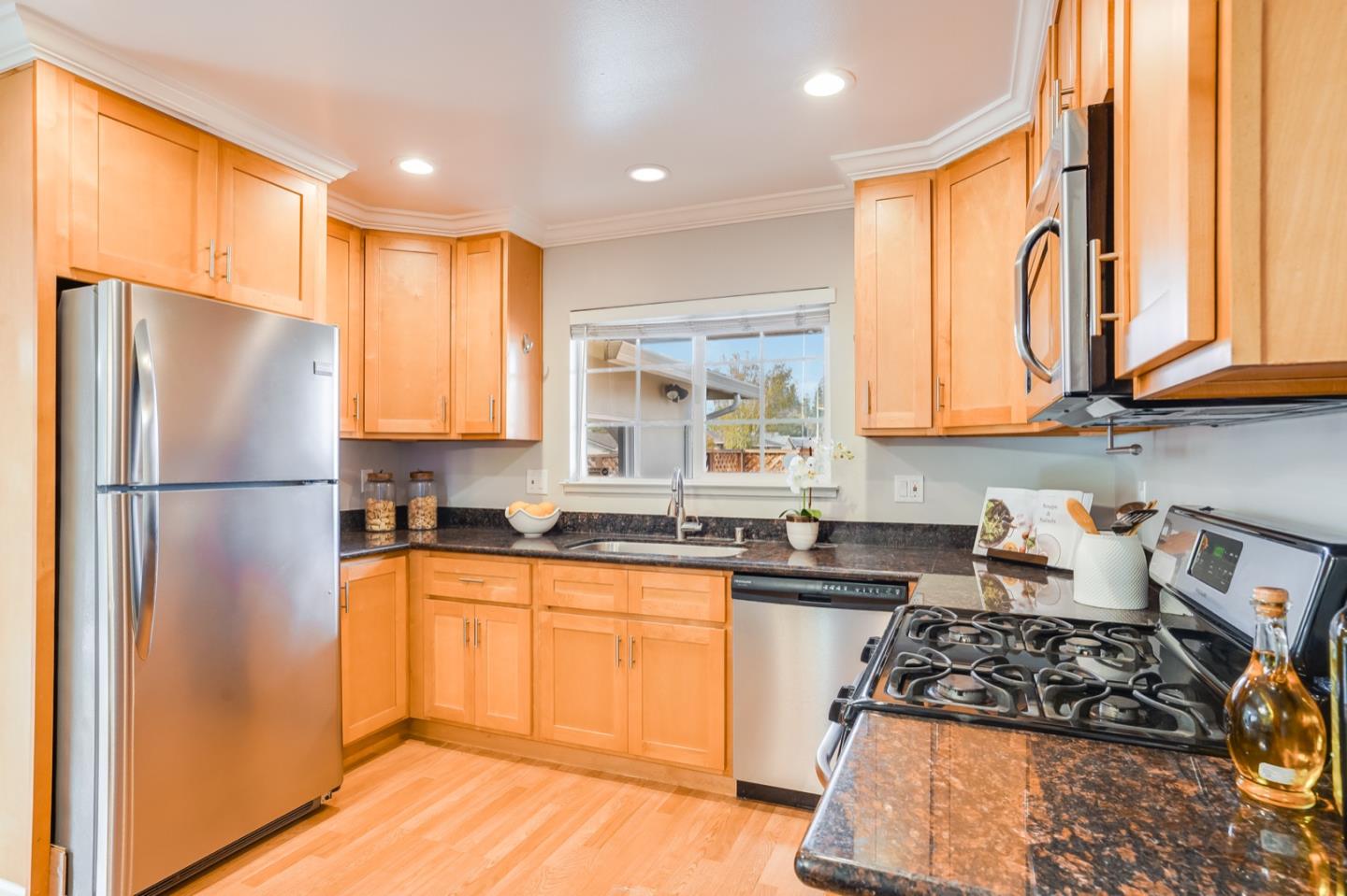 2101 Briarwood Drive Santa Clara, CA 95051 - Photo 8 of 41 a kitchen with stainless steel appliances granite countertop a refrigerator sink and cabinets