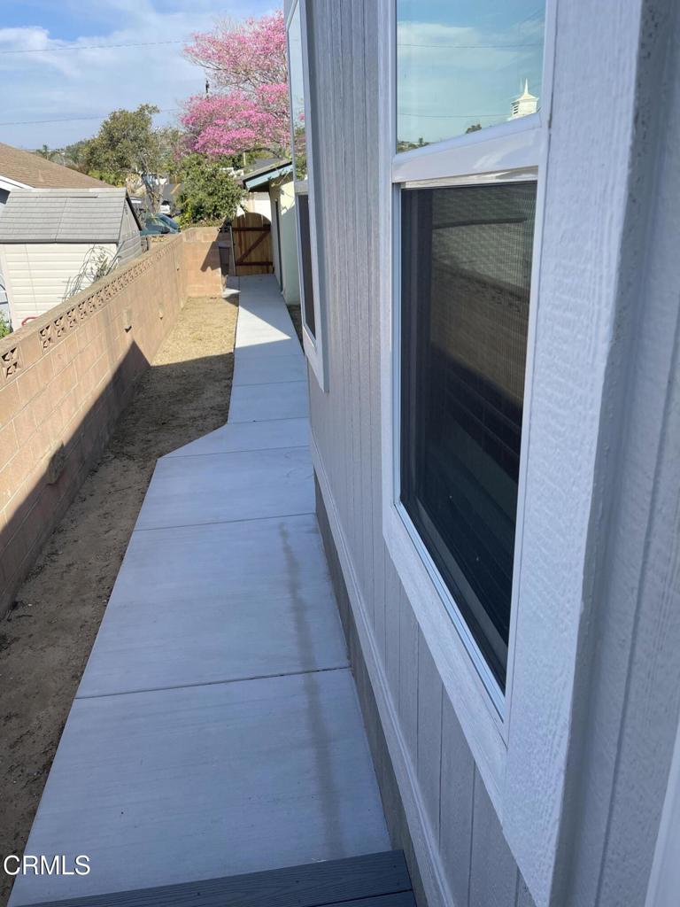 1908 B Sorrel Street Camarillo, CA 93010 - Photo 11 of 11 a view of a hallway with wooden floor and a potted plant
