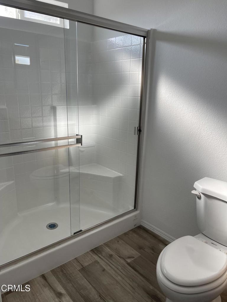 1908 B Sorrel Street Camarillo, CA 93010 - Photo 4 of 11 a bathroom with a shower a toilet and a glass window