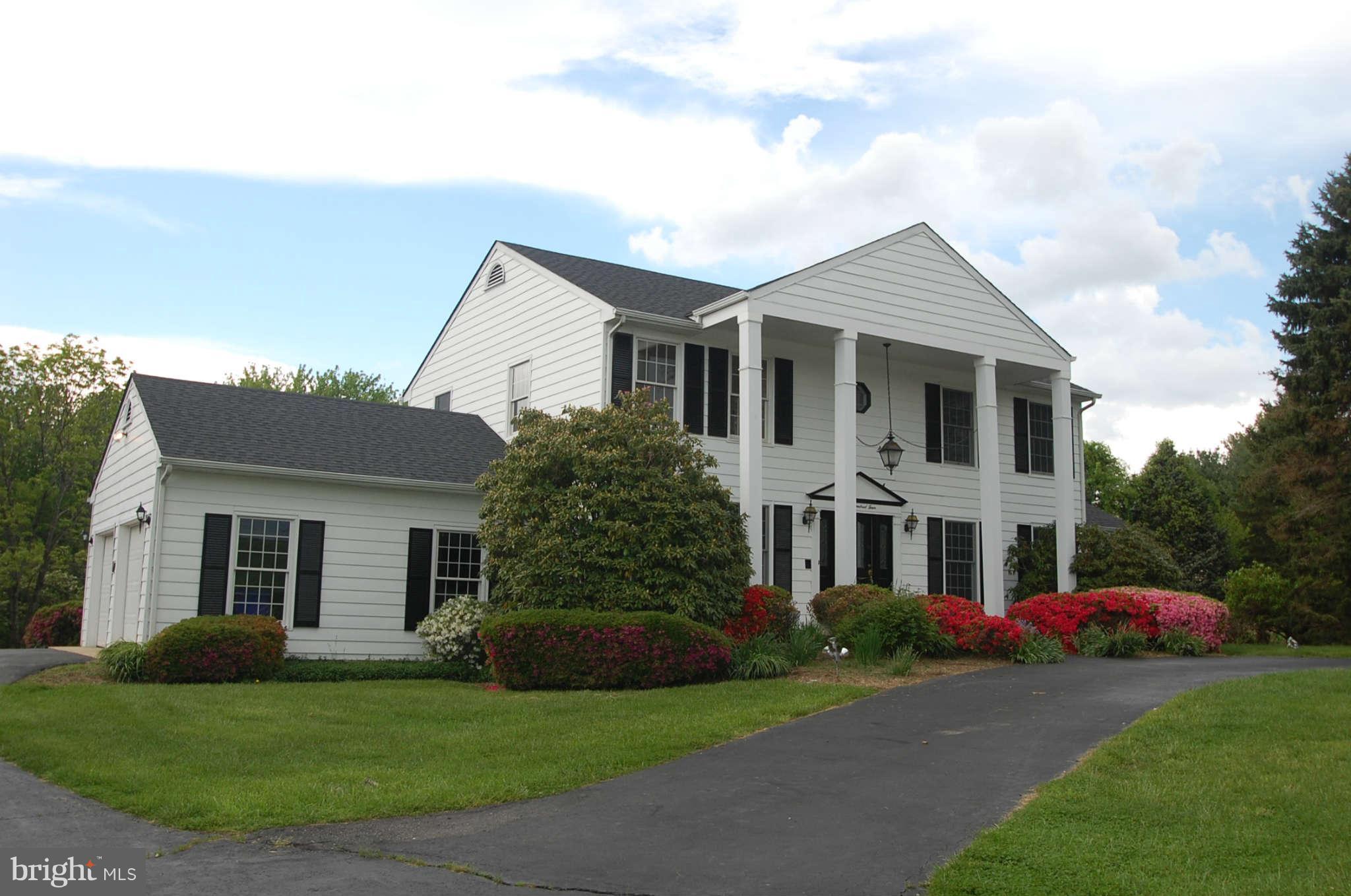 1904 Ednor Road Silver Spring, MD 20905 - Photo 1 of 30 a front view of a house with a garden