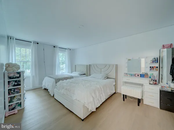 a bedroom with a bed furniture and a window