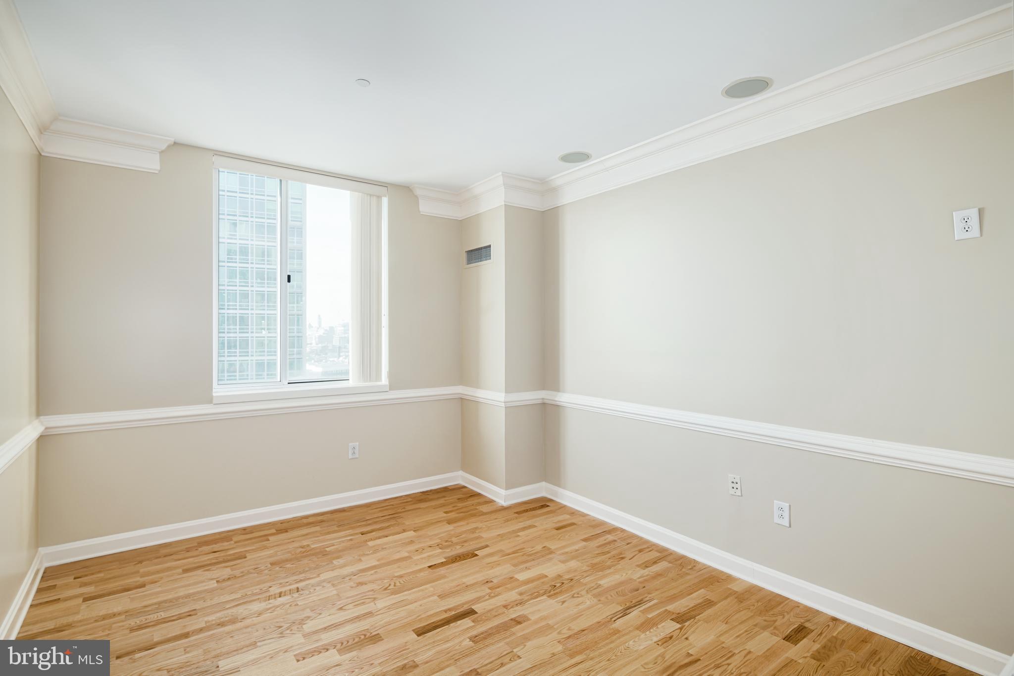 901 North Penn Street, Unit R1902 Philadelphia, PA 19123 - Photo 19 of 34 a view of empty room with wooden floor and fan