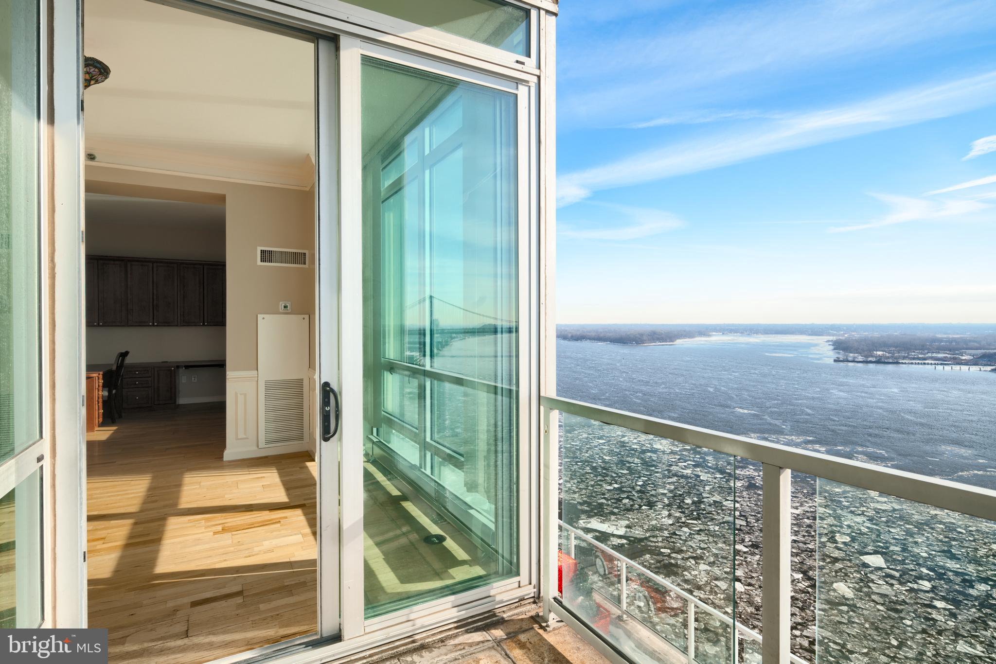 901 North Penn Street, Unit R1902 Philadelphia, PA 19123 - Photo 28 of 34 a view of balcony with floor to ceiling window and wooden floor