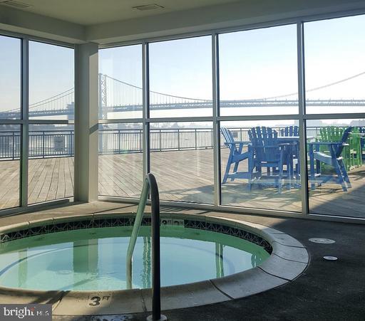 901 North Penn Street, Unit R1902 Philadelphia, PA 19123 - Photo 33 of 34 a bathroom with a large window vanity and sink