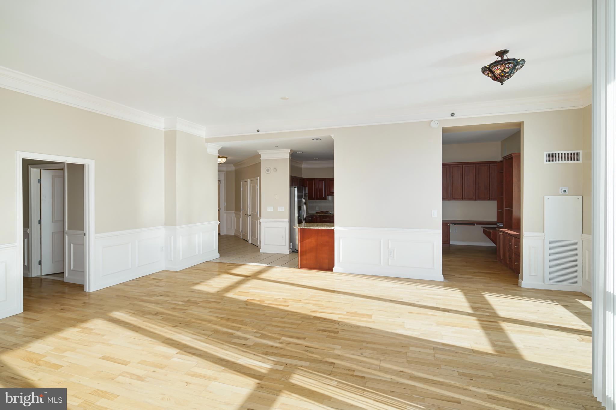 901 North Penn Street, Unit R1902 Philadelphia, PA 19123 - Photo 7 of 34 a bedroom with a bed and a view of bathroom