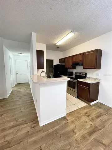 a bathroom with a toilet sink vanity and mirror