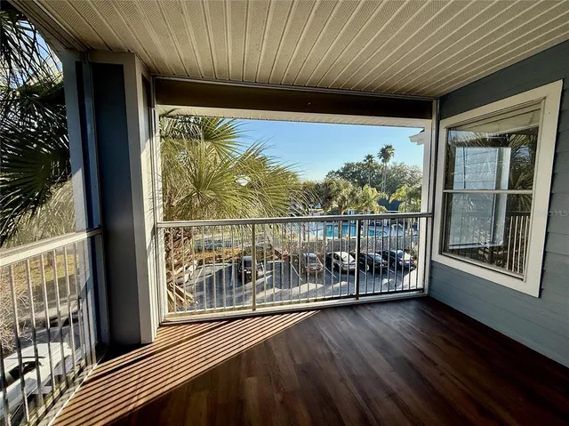 a view of an empty room and a window
