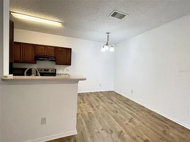 a workspace with furniture and flat screen tv