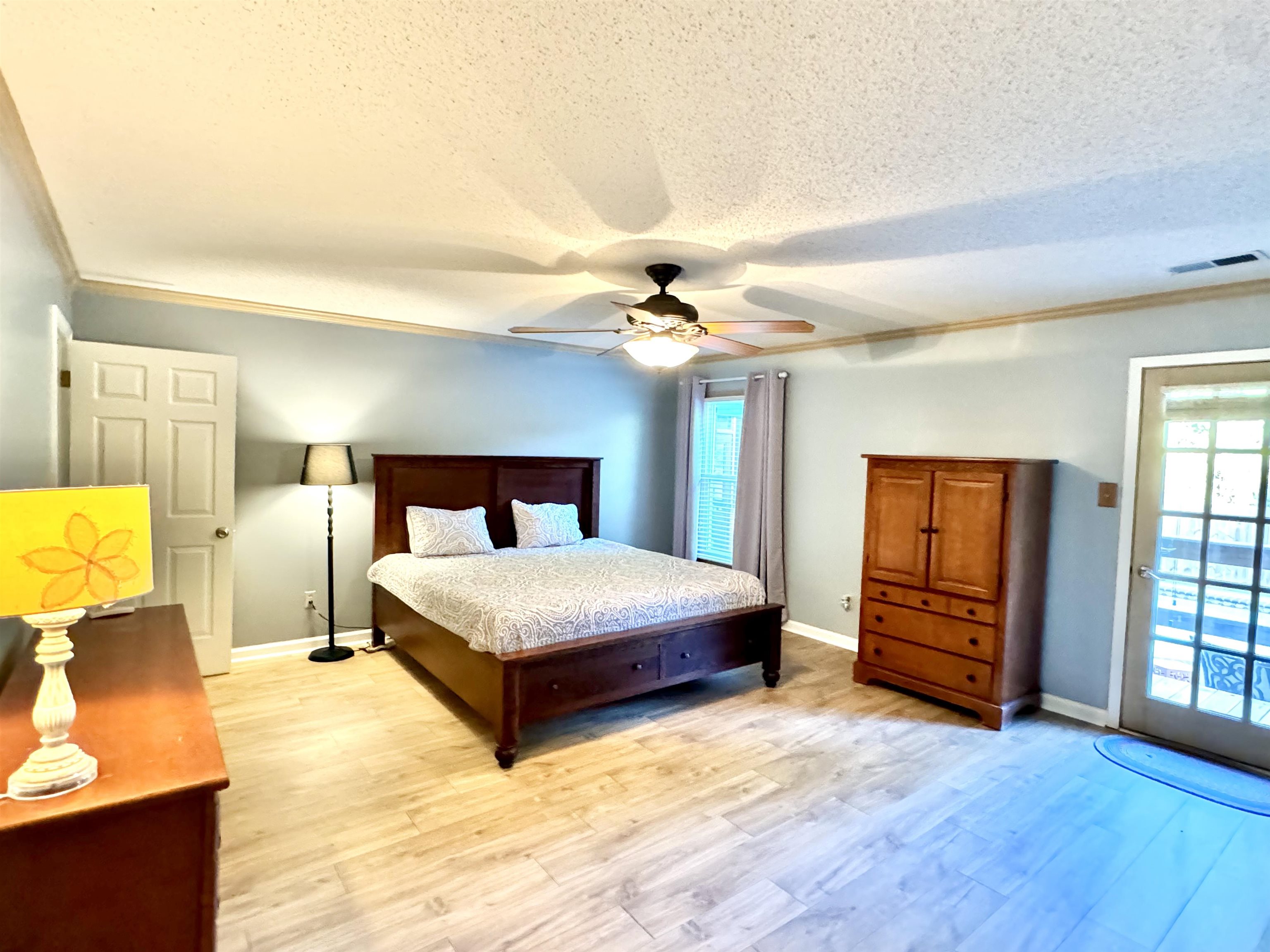 641 Hermitage Trail Collierville, TN 38017 - Photo 17 of 24 Spacious room featuring light wood-finish flooring, a ceiling fan, and crown molding