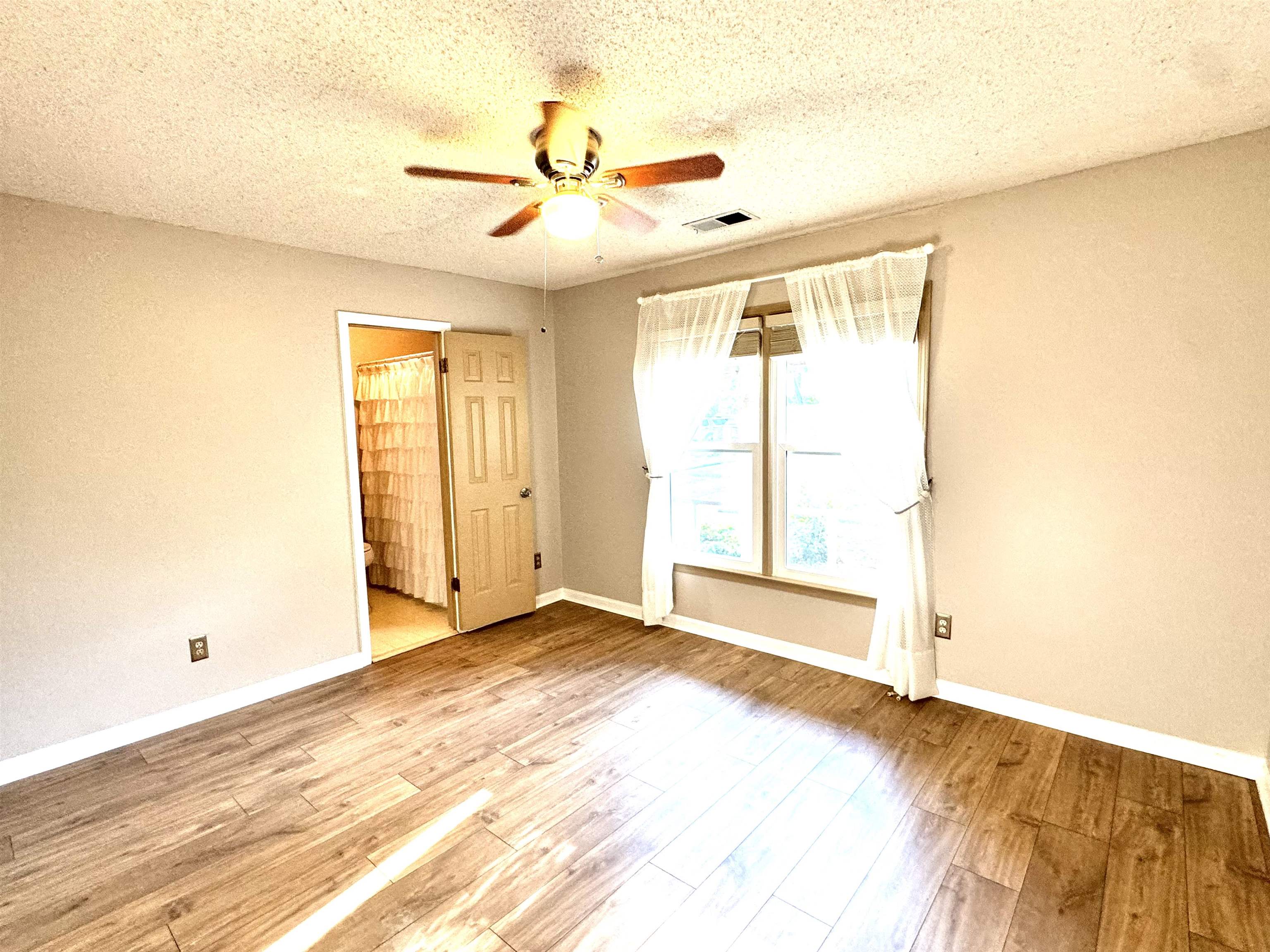 641 Hermitage Trail Collierville, TN 38017 - Photo 21 of 24 Interior room featuring wood-finish flooring and neutral wall tones