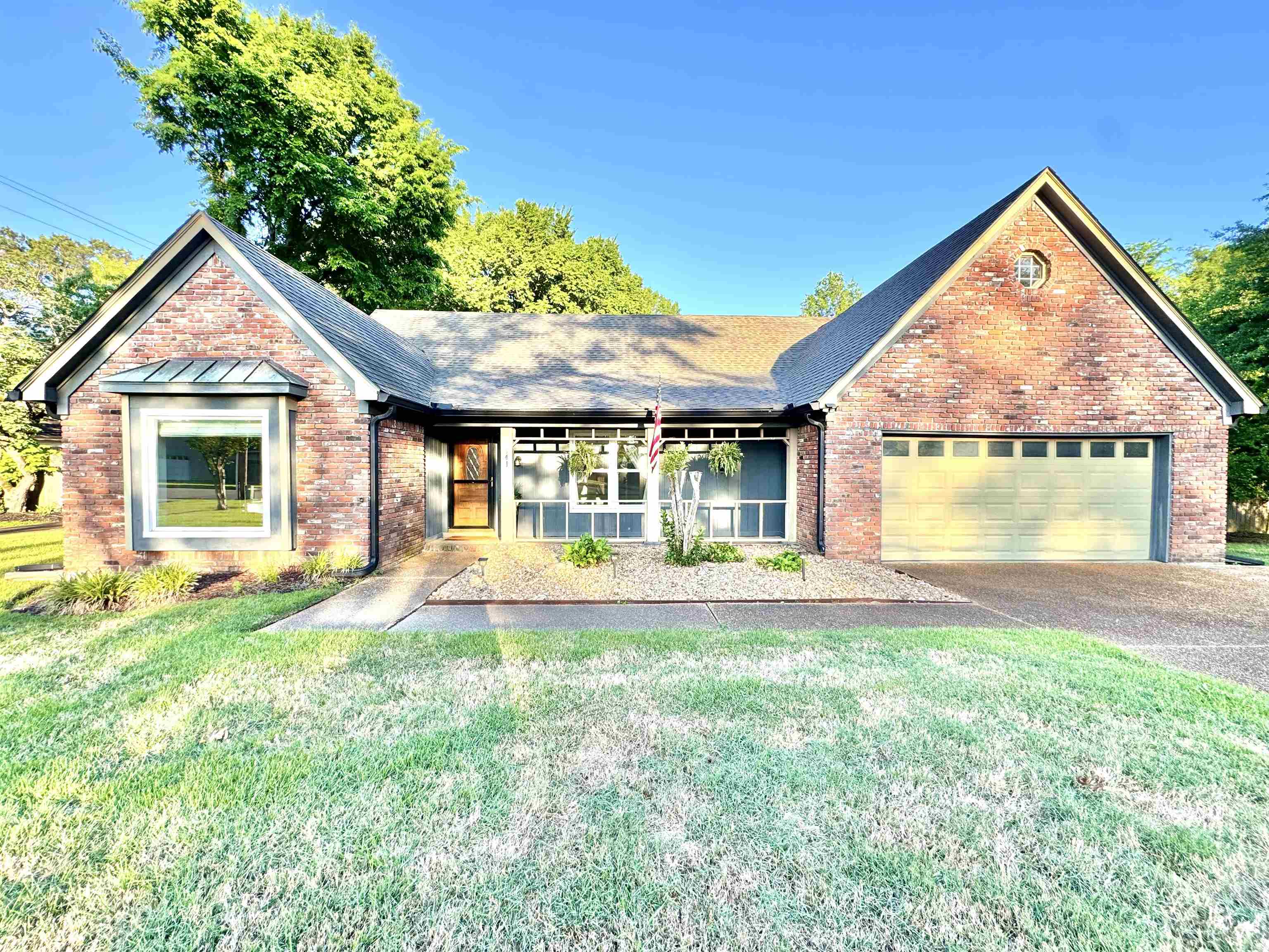 641 Hermitage Trail Collierville, TN 38017 - Photo 3 of 24 Brick exterior with a prominent bay window featuring a metal awning