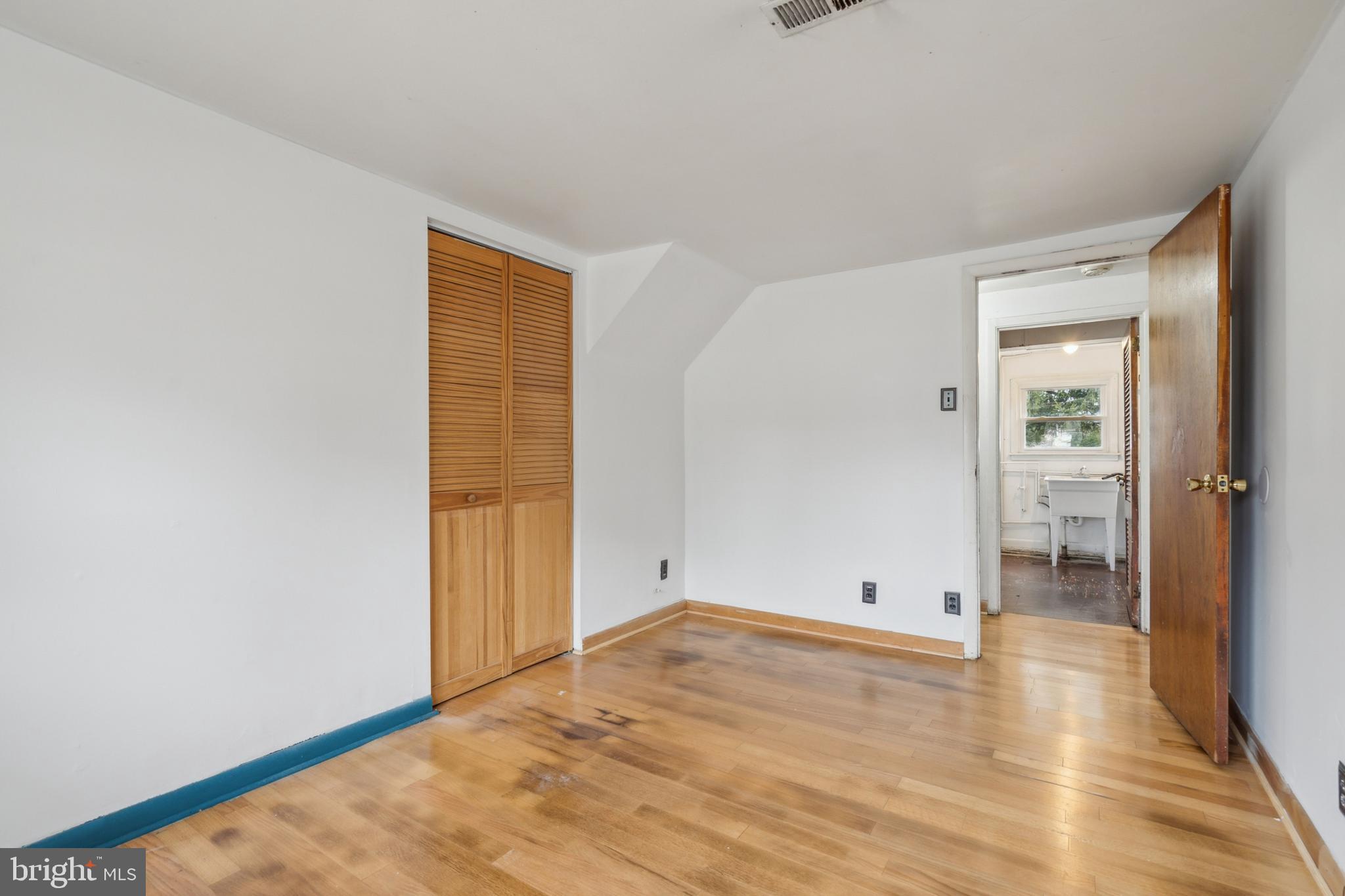 107 Surrey Road Voorhees, NJ 08043 - Photo 20 of 25 an empty room with wooden floor and bathroom