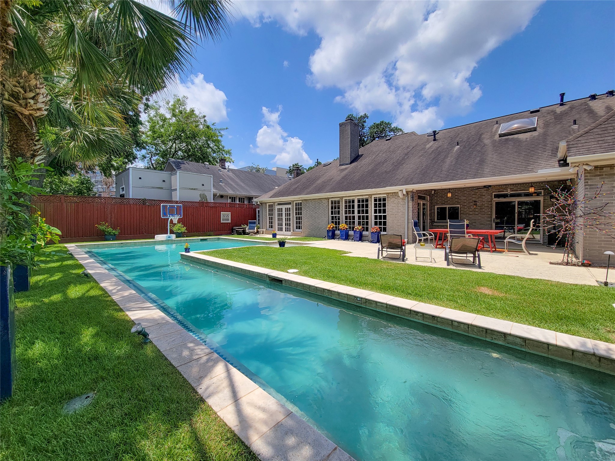 4401 Roseland Street Houston, TX 77006 - Photo 38 of 46 Saline Lap Pool flows into Main Pool, all surrounded by Green Grassy Areas, that children and dogs will LOVE!
