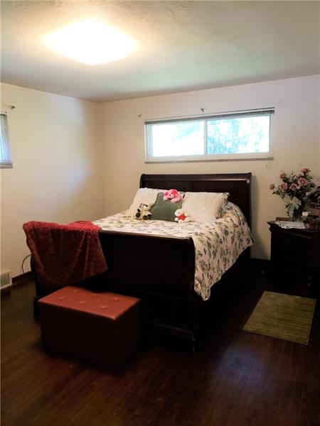 144 Jacks Run Road Pittsburgh, PA 15214 - Photo 9 of 21 Master bedroom with hardwood floors