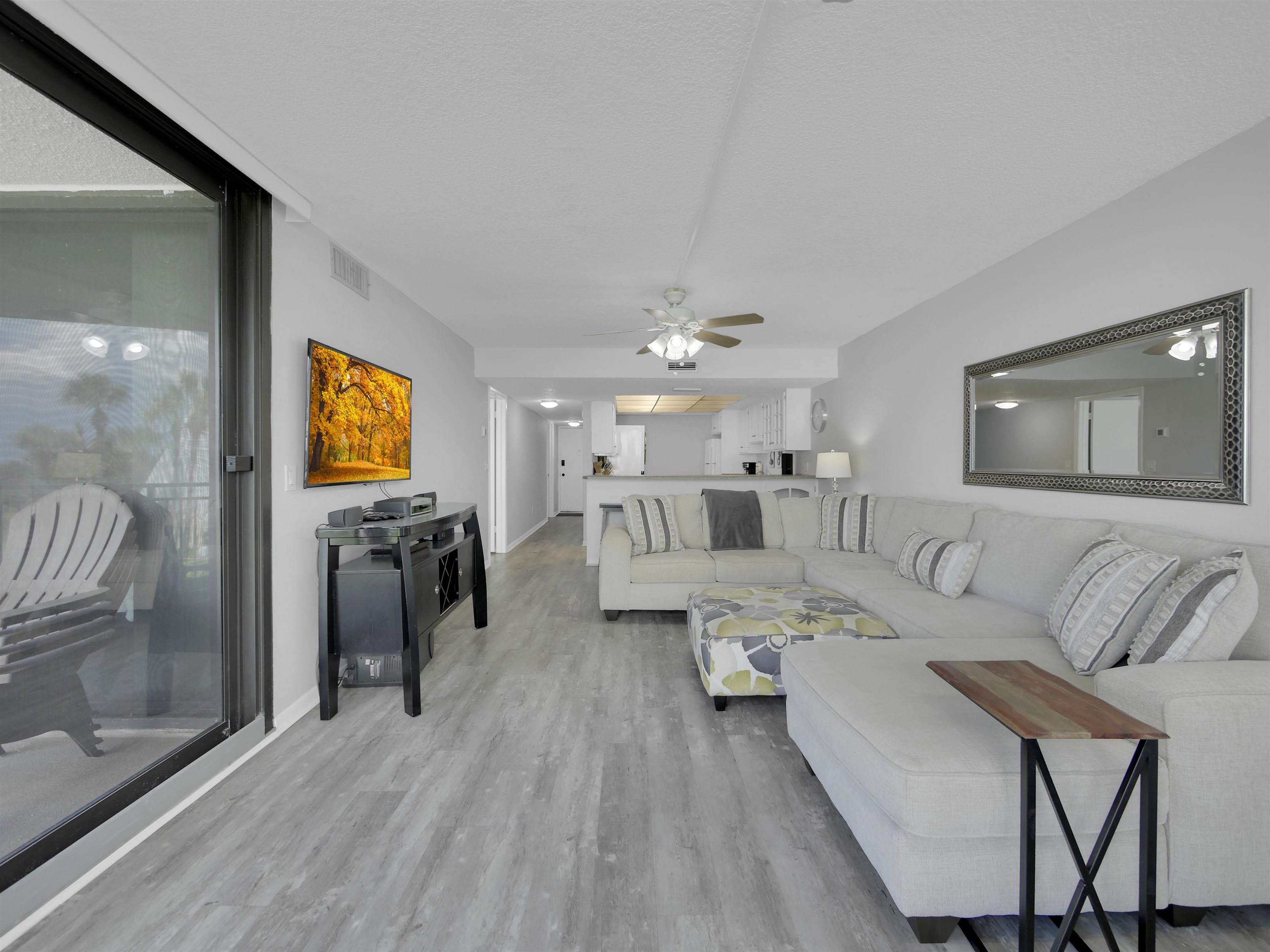 2 Dondanville Road, Unit 211 St. Augustine, FL 32080 - Photo 14 of 30 a living room with furniture and a flat screen tv
