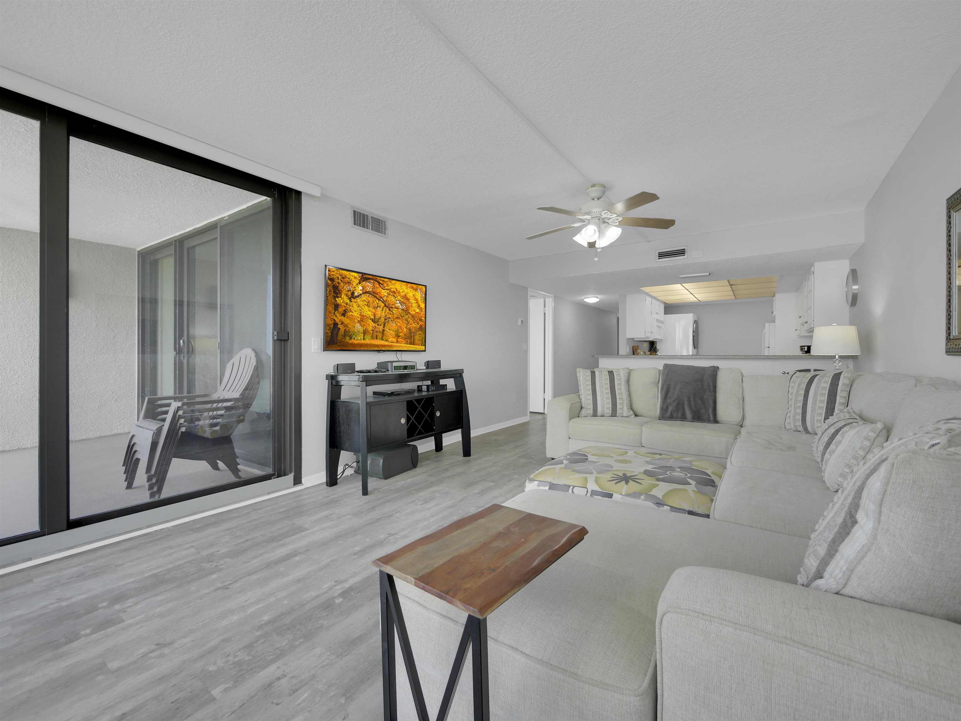 2 Dondanville Road, Unit 211 St. Augustine, FL 32080 - Photo 15 of 30 a view of a livingroom with furniture and a flat screen tv