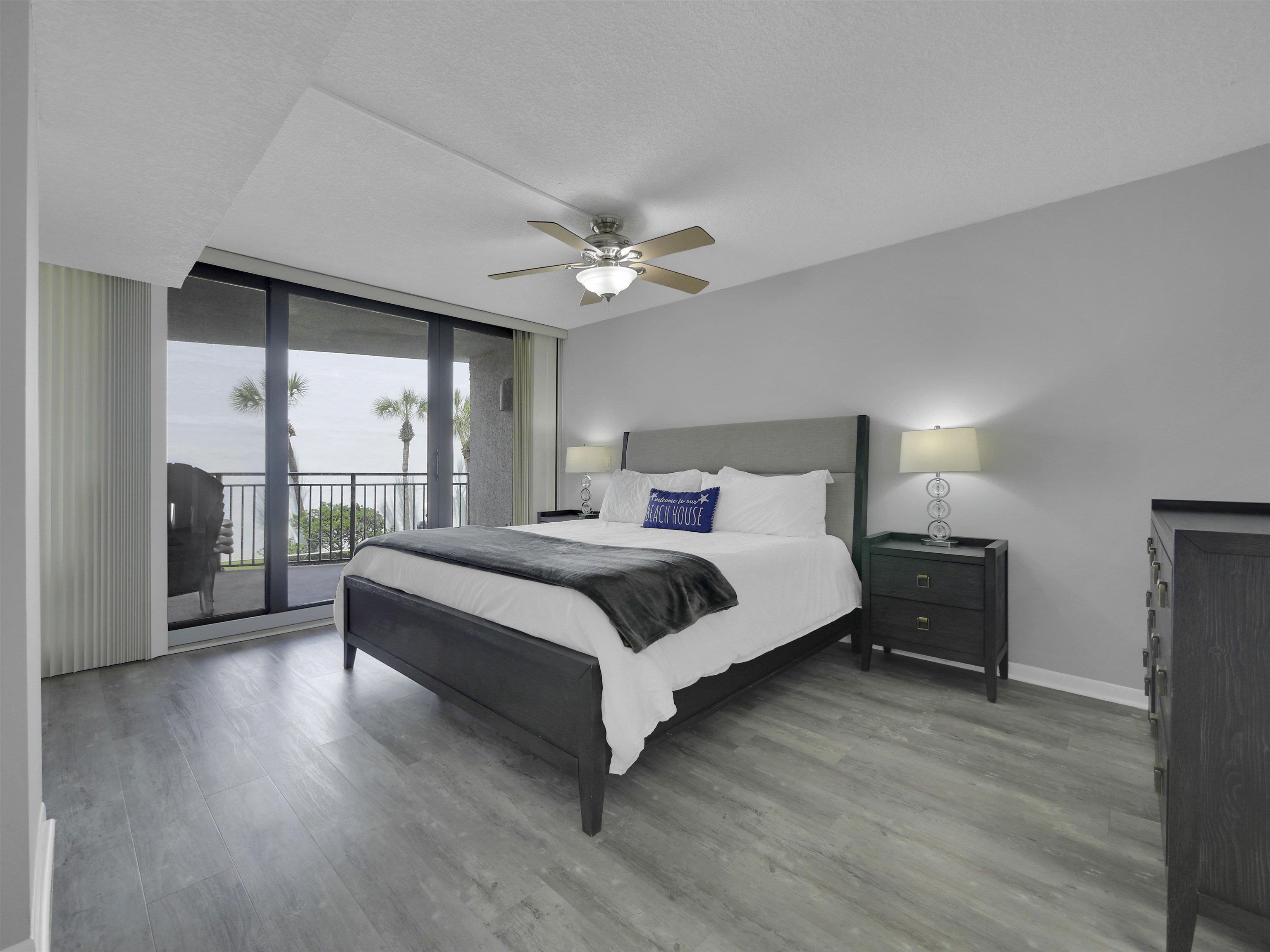 2 Dondanville Road, Unit 211 St. Augustine, FL 32080 - Photo 17 of 30 a bedroom with a large bed and a chandelier