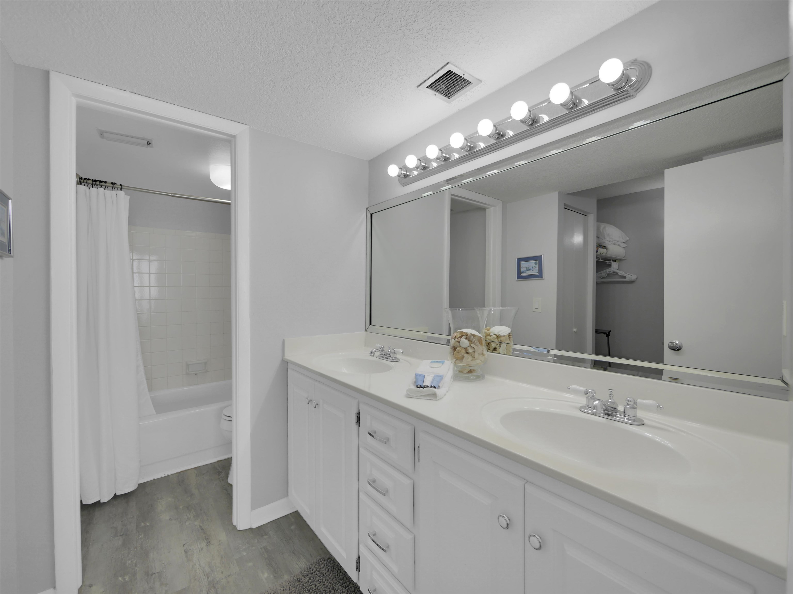 2 Dondanville Road, Unit 211 St. Augustine, FL 32080 - Photo 20 of 30 a bathroom with double vanity and a mirror
