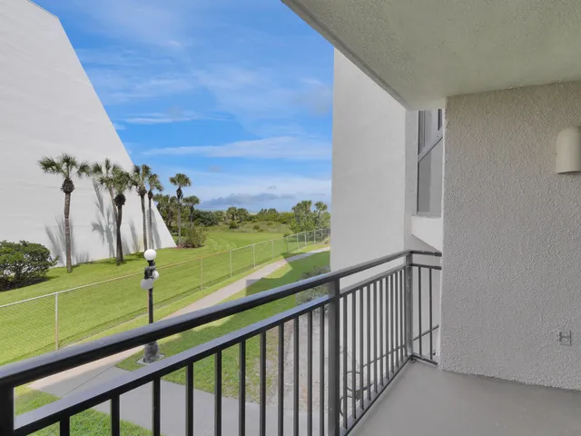 a view of a balcony with an outdoor space