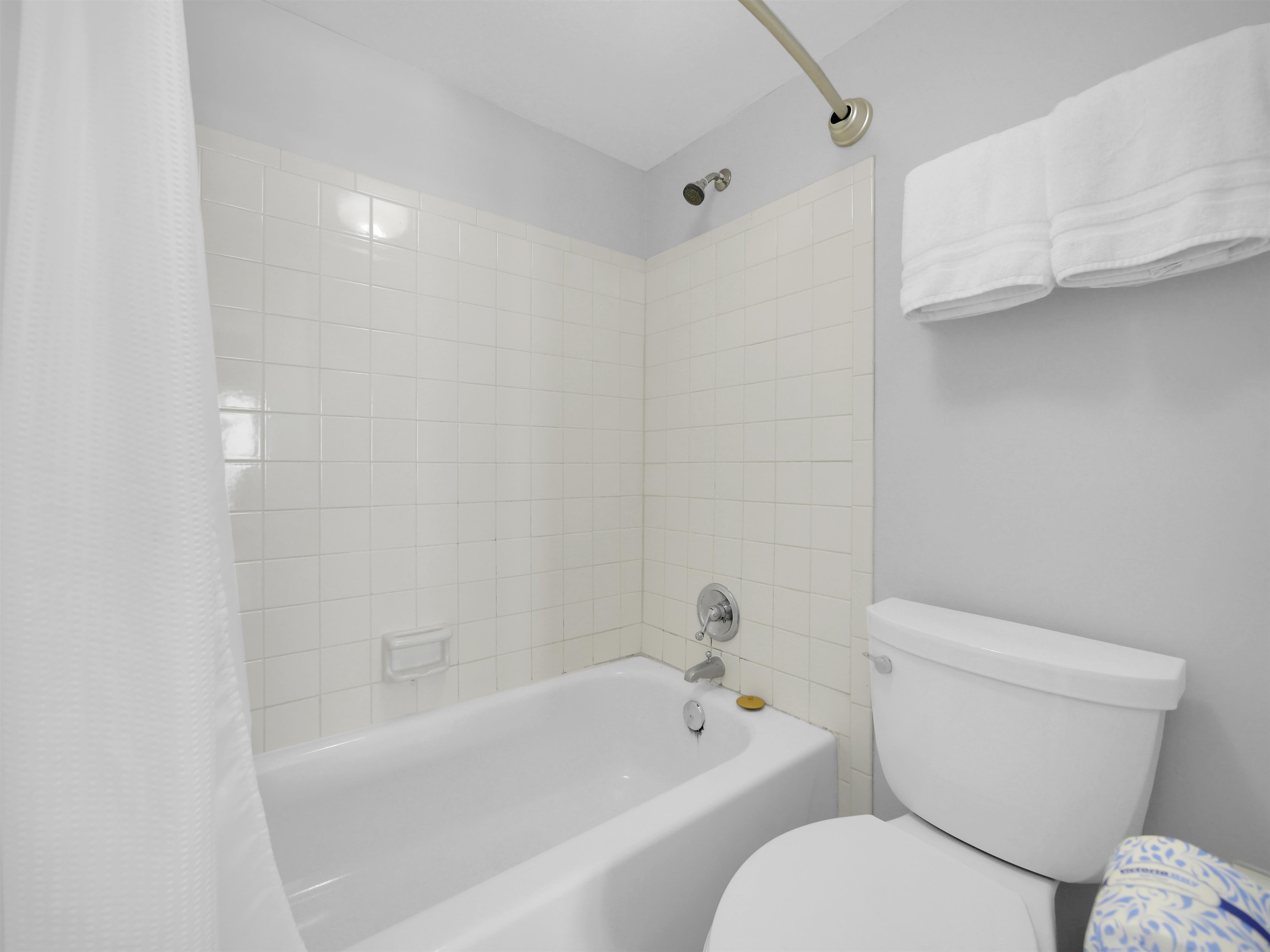2 Dondanville Road, Unit 211 St. Augustine, FL 32080 - Photo 22 of 30 a white toilet sitting next to a bath tub