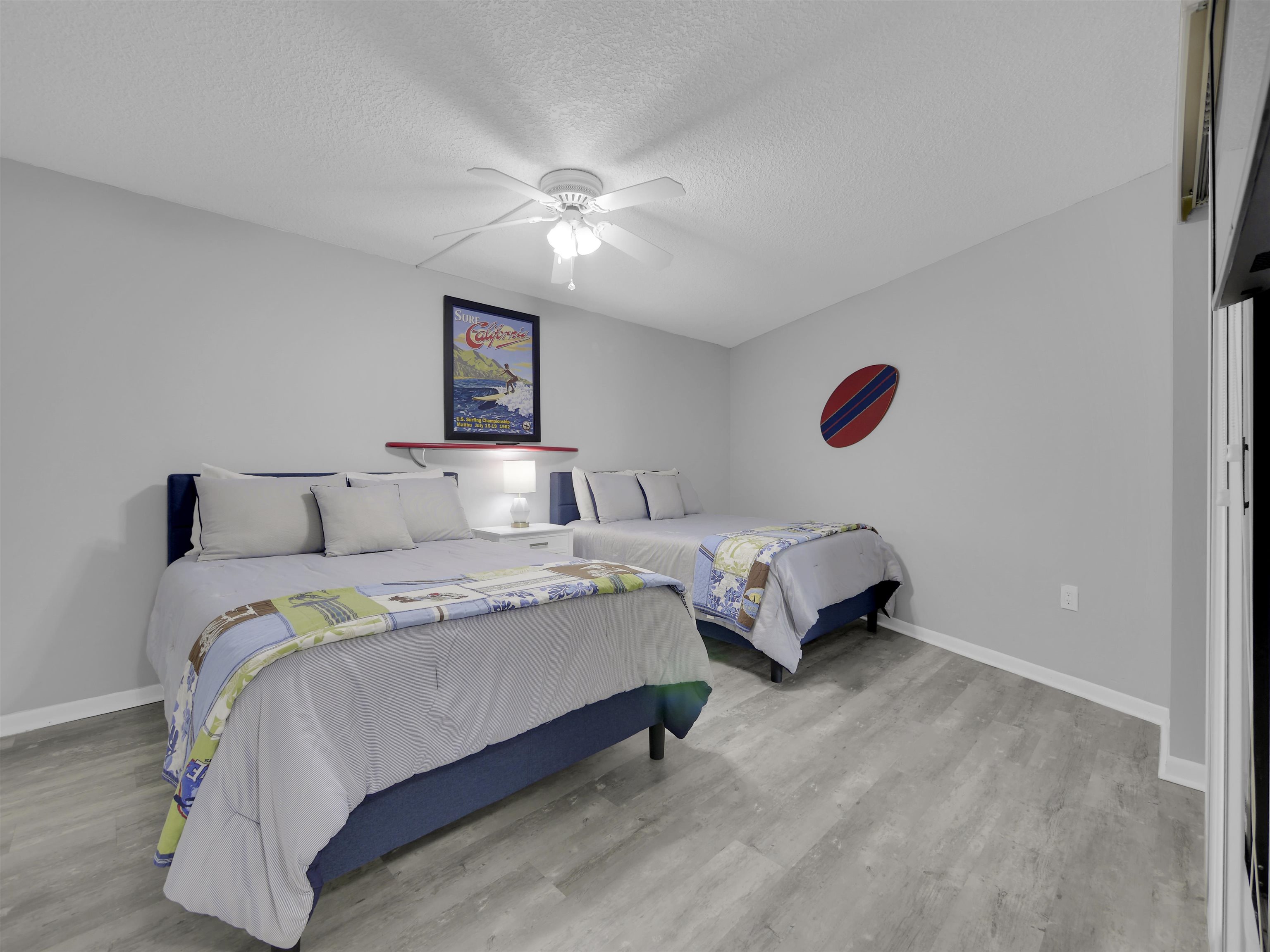 2 Dondanville Road, Unit 211 St. Augustine, FL 32080 - Photo 23 of 30 a bedroom with a bed and a chandelier