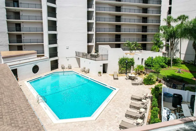 a view of a swimming pool with a patio