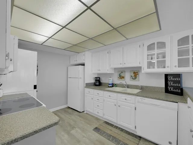 a kitchen with cabinets and window