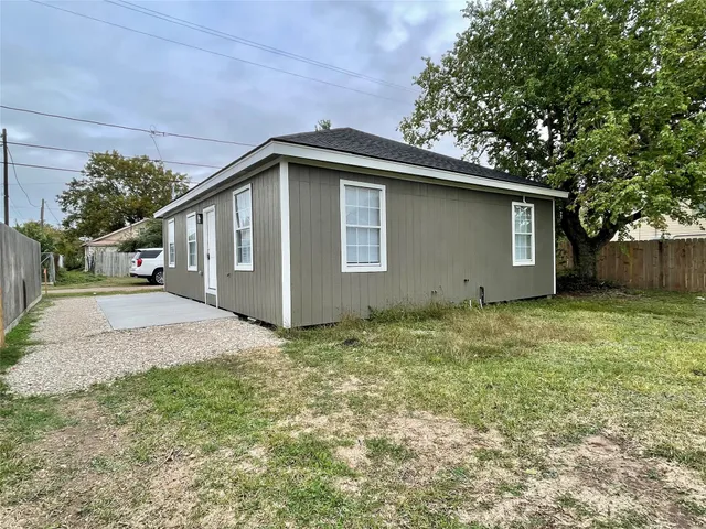 a backyard of a house with lots of green space