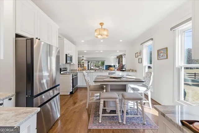 a white toilet sitting next to a white sink