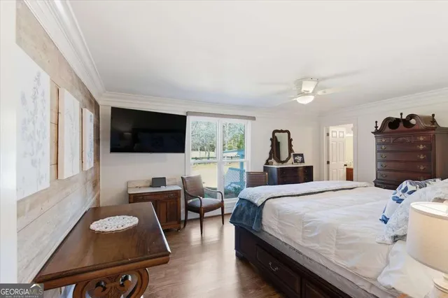 a roof deck with table and chairs and wooden floor