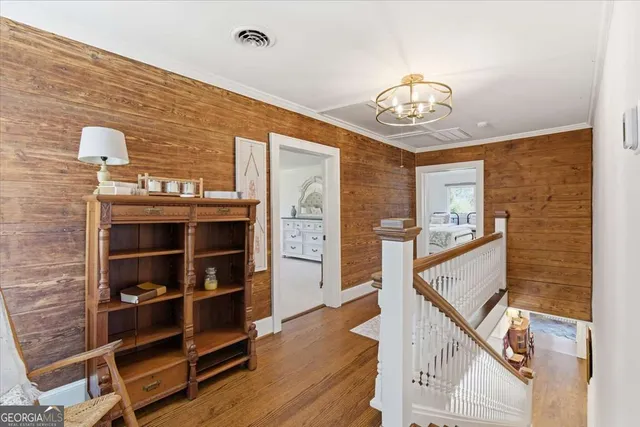 a view of a house with a yard and tree s