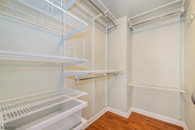 a view of a room with wooden floor and staircase