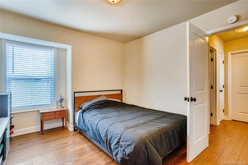 2147 Manawa Lane Tega Cay, SC 29708 - Photo 17 of 28 a bedroom with a bed and wooden floor