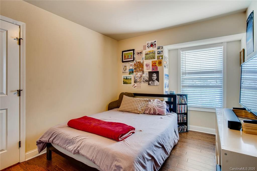 2147 Manawa Lane Tega Cay, SC 29708 - Photo 18 of 28 a bedroom with a bed and a table in it