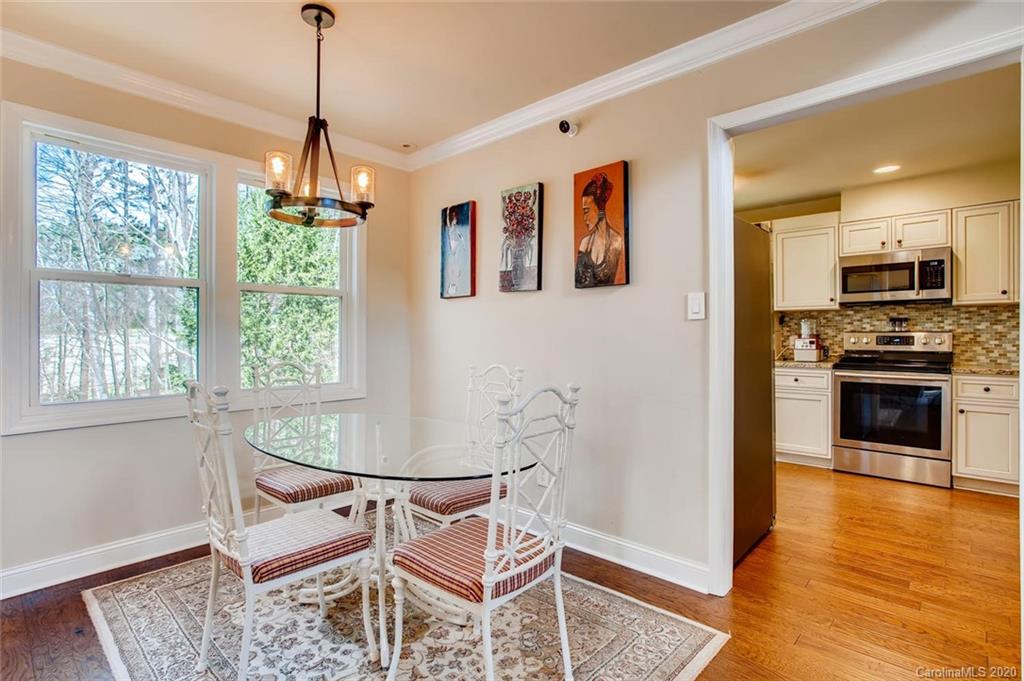 2147 Manawa Lane Tega Cay, SC 29708 - Photo 21 of 28 a view of a dining room with furniture window and wooden floor