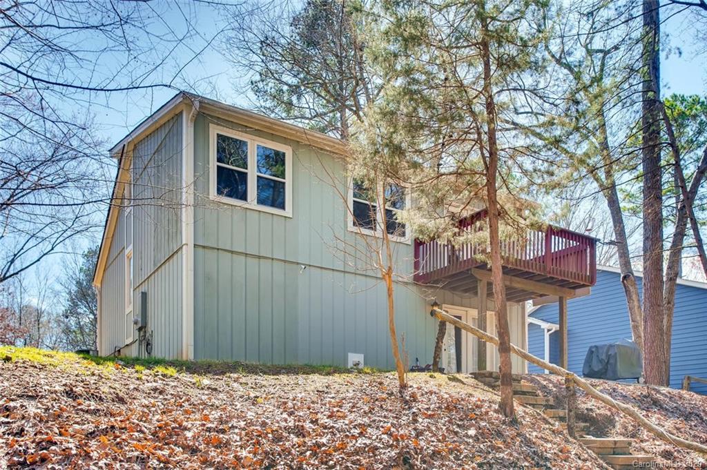 2147 Manawa Lane Tega Cay, SC 29708 - Photo 25 of 28 a backyard of a house with large trees