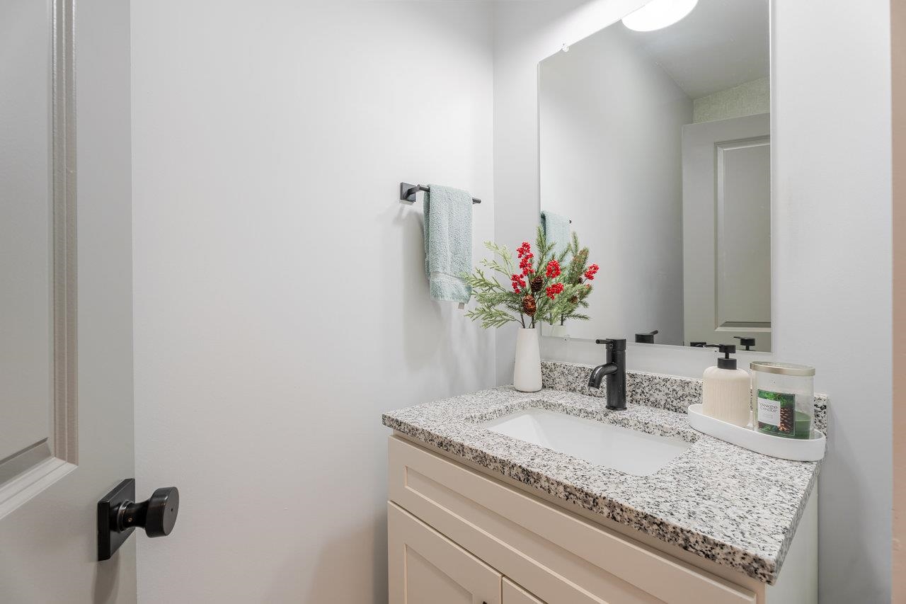 34 Field Court Bridgewater, VA 22812 - Photo 25 of 42 a bathroom with a granite countertop sink and a mirror