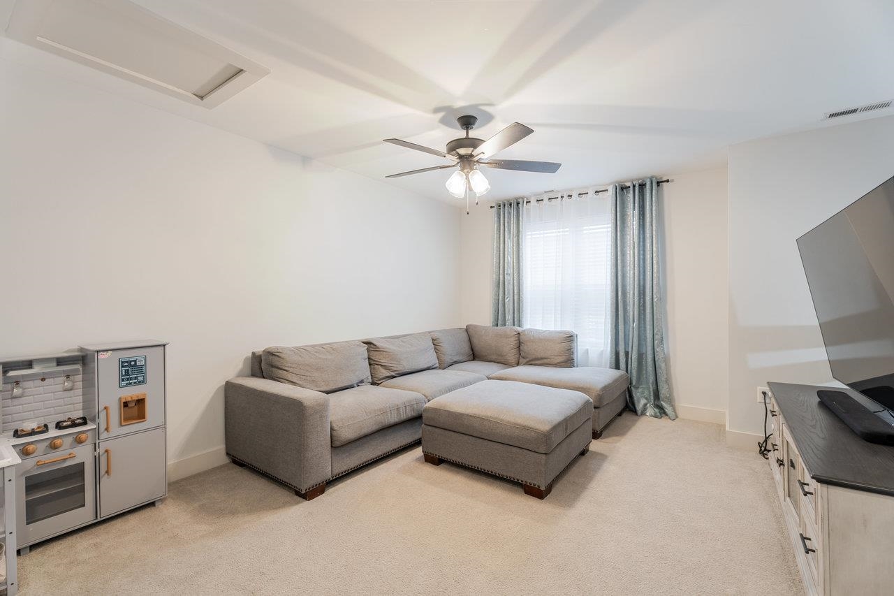 34 Field Court Bridgewater, VA 22812 - Photo 26 of 42 a living room with furniture and a flat screen tv