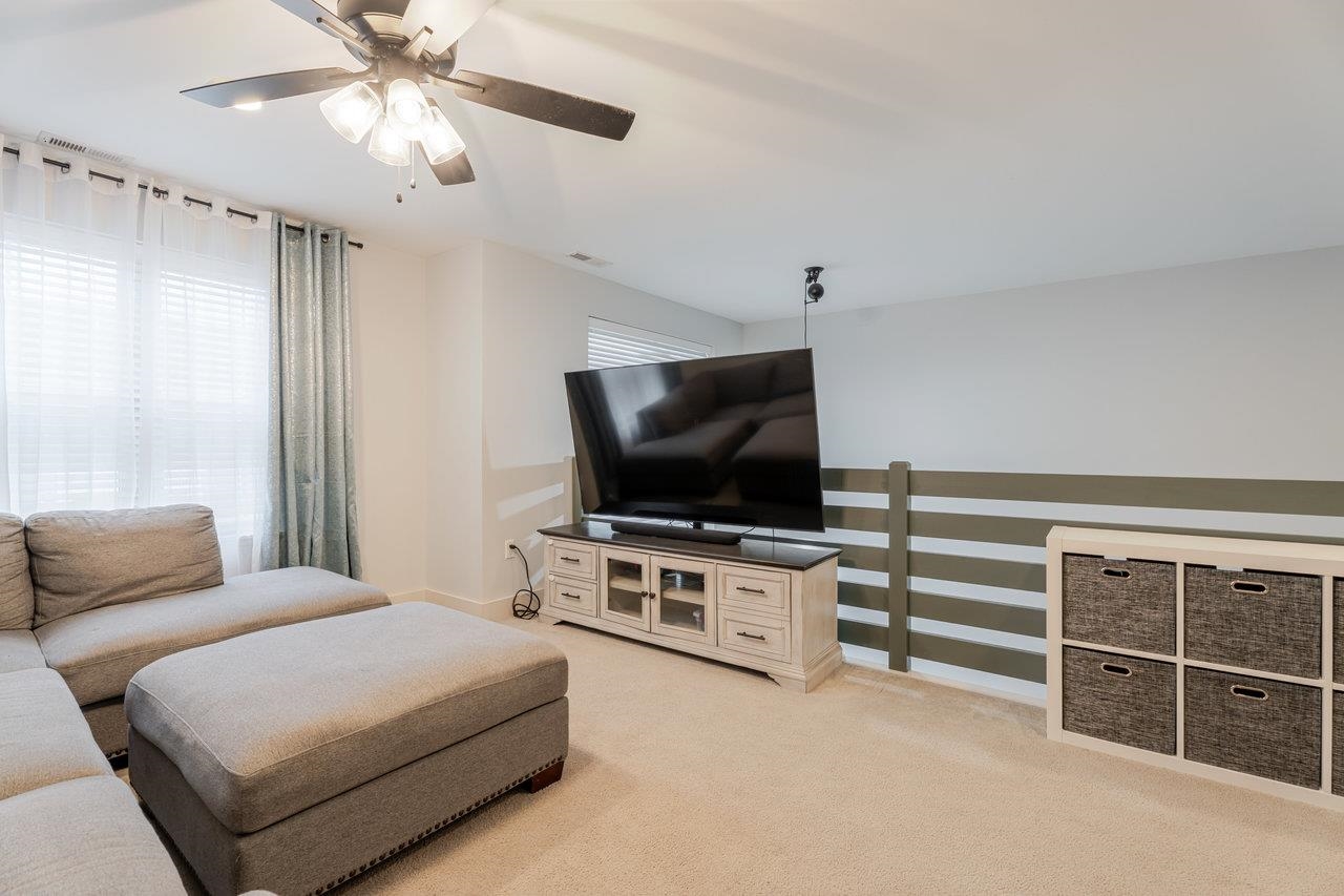 34 Field Court Bridgewater, VA 22812 - Photo 27 of 42 a living room with furniture and a flat screen tv