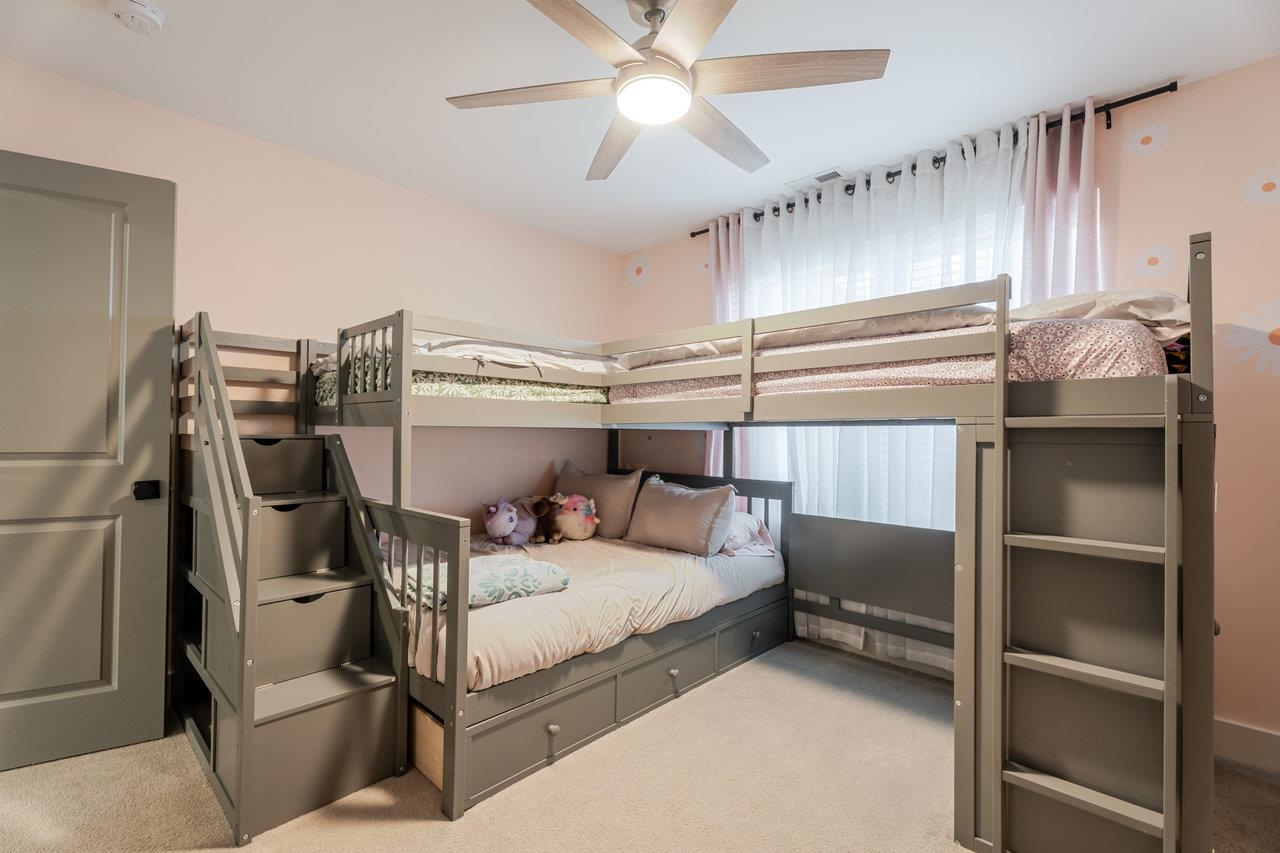 34 Field Court Bridgewater, VA 22812 - Photo 30 of 42 a bedroom with a bed and a chandelier