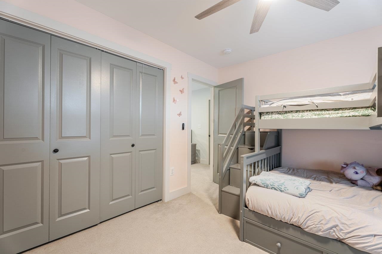 34 Field Court Bridgewater, VA 22812 - Photo 31 of 42 a bedroom with a bed and a chandelier