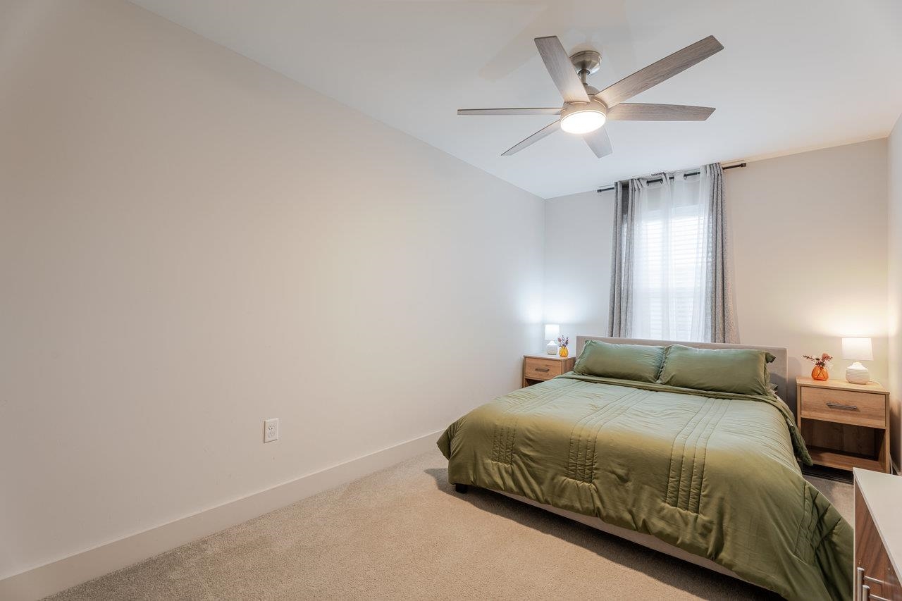 34 Field Court Bridgewater, VA 22812 - Photo 32 of 42 a bedroom with a large bed and a ceiling fan